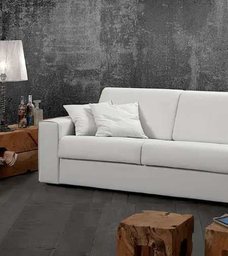 Divano letto in tessuto chiaro dalla linea essenziale Cocò di Excò