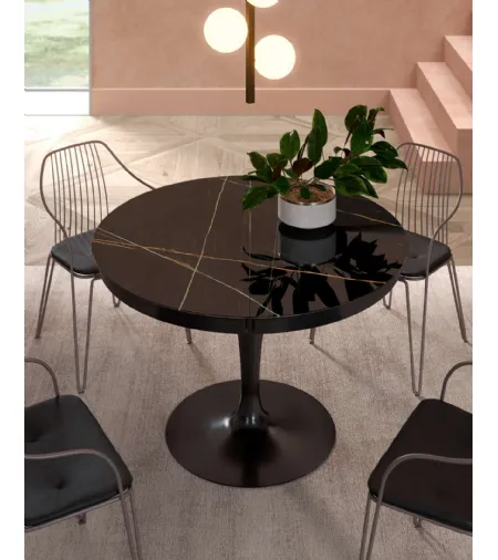 Tavolo rotondo allungabile Eclipse con top in marble glass Sahara Noir Lucido di Ozzio